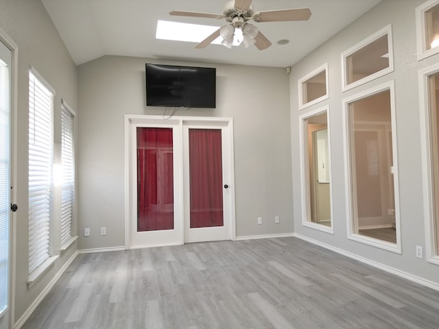 10 Lafayette Pl, Odessa, TX 79762 - entrance foyer with a ceiling fan, wood finished floors, a skylight, lofted ceiling, and baseboards