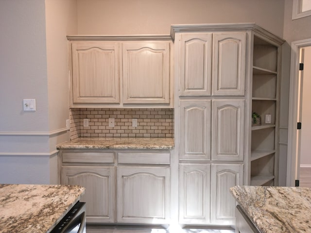 10 Lafayette Pl, Odessa, TX 79762 - kitchen featuring backsplash and light stone countertops
