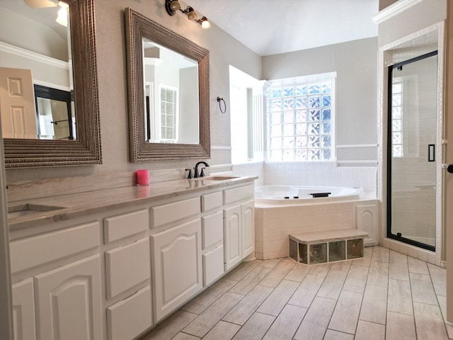 10 Lafayette Pl, Odessa, TX 79762 - bathroom featuring a bath, a stall shower, and vanity