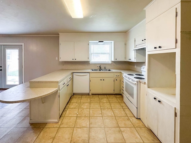 111 N 24th St, Lamesa, TX 79331 - kitchen with white appliances, a peninsula, under cabinet range hood, a sink, and light countertops