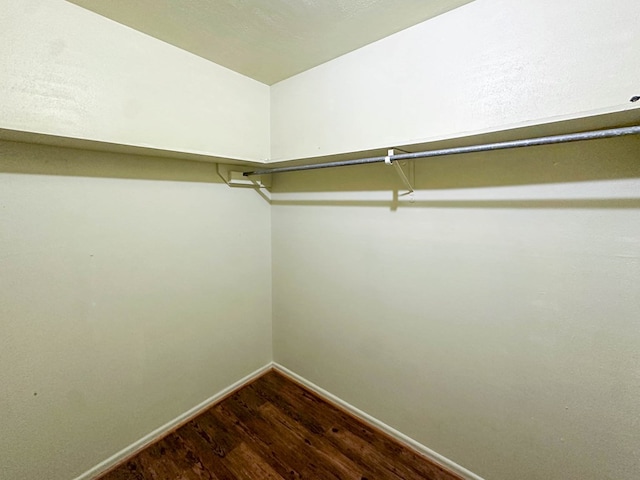 111 N 24th St, Lamesa, TX 79331 - walk in closet featuring dark wood-style floors