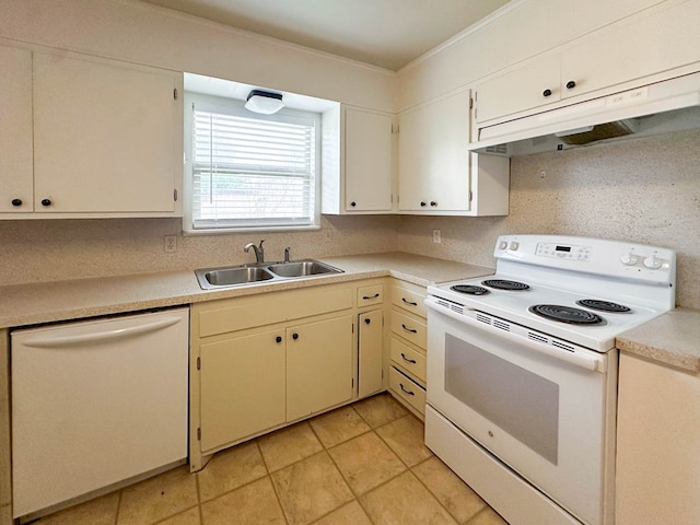 111 N 24th St, Lamesa, TX 79331 - kitchen with white appliances, a sink, under cabinet range hood, light countertops, and ornamental molding