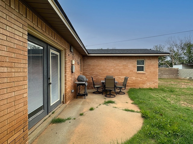 111 N 24th St, Lamesa, TX 79331 - view of patio featuring a grill and outdoor dining space