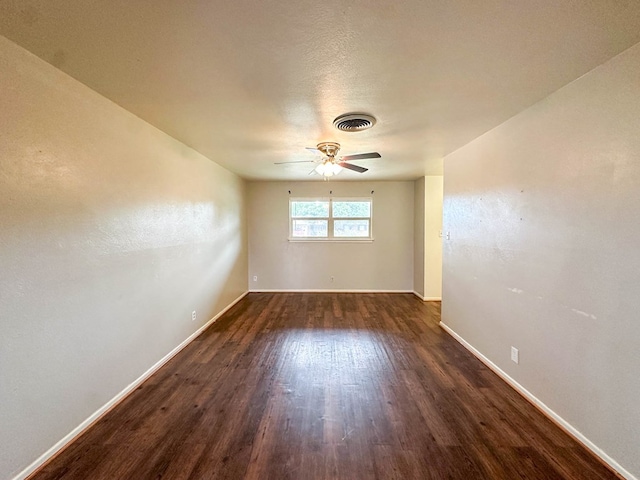 111 N 24th St, Lamesa, TX 79331 - unfurnished room with dark wood-type flooring, baseboards, and ceiling fan