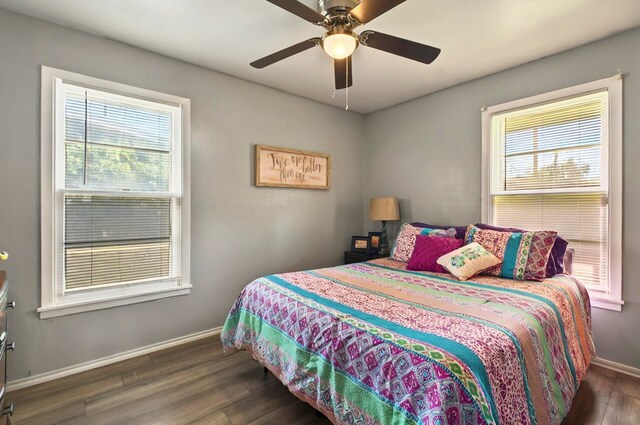 811 NW 7th St, Andrews, TX 79714 - bedroom featuring wood finished floors, baseboards, and ceiling fan