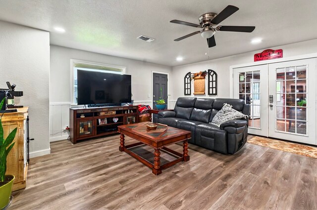 811 NW 7th St, Andrews, TX 79714 - living area featuring wood finished floors, ceiling fan, french doors, recessed lighting, and baseboards