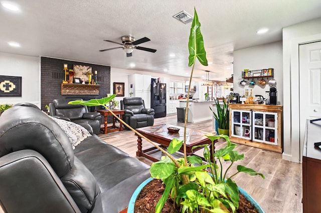 811 NW 7th St, Andrews, TX 79714 - living room with a ceiling fan, light wood-type flooring, and recessed lighting