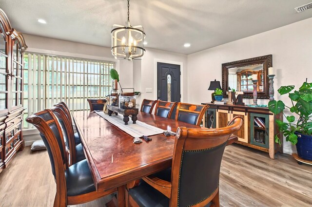 811 NW 7th St, Andrews, TX 79714 - dining space featuring a chandelier, wood finished floors, and recessed lighting