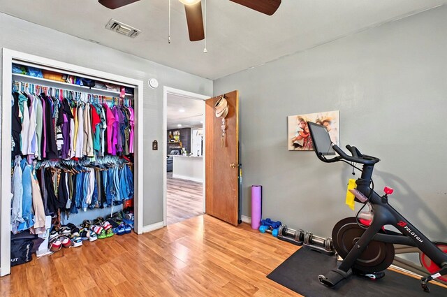 811 NW 7th St, Andrews, TX 79714 - workout room featuring ceiling fan, wood finished floors, and baseboards
