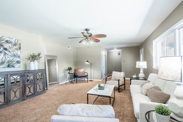 1403 E 17th St, Odessa, TX 79761 - carpeted living room featuring a ceiling fan and baseboards