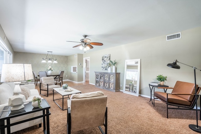 1403 E 17th St, Odessa, TX 79761 - carpeted living area featuring baseboards, healthy amount of natural light, and ceiling fan