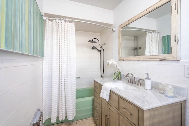1403 E 17th St, Odessa, TX 79761 - bathroom with tile walls, shower / bath combination with curtain, vanity, radiator, and decorative backsplash