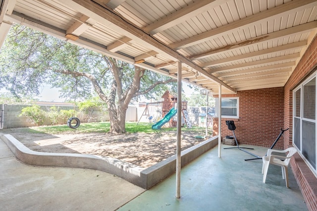 1403 E 17th St, Odessa, TX 79761 - fenced backyard with a playground and a patio