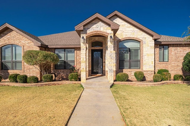 view of front of property with a front lawn