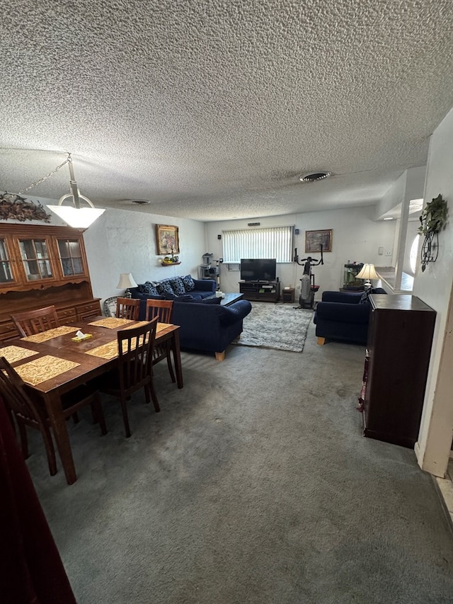 1214 E Century Ave, Odessa, TX 79762 - dining space with a textured ceiling and carpet floors