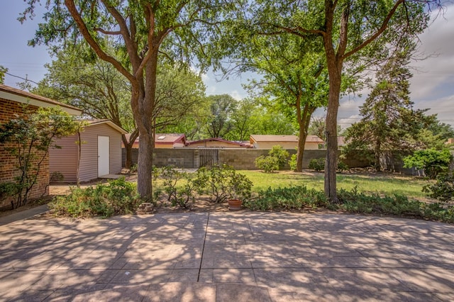 view of patio / terrace featuring an outbuilding and a fenced backyard