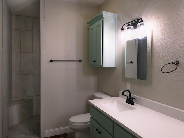 bathroom featuring toilet and vanity