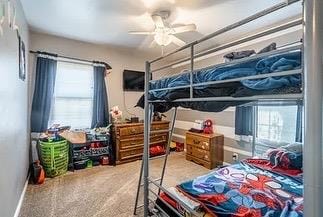 carpeted bedroom featuring ceiling fan