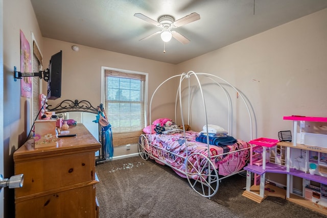 bedroom with ceiling fan and dark colored carpet