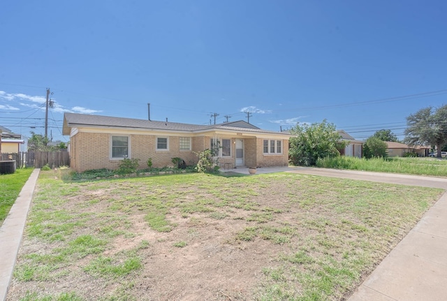 ranch-style house with a front lawn