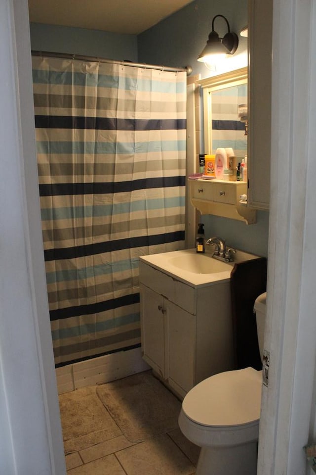 2711 W 83rd St, Odessa, TX 79764 - full bath featuring vanity, tile patterned flooring, and a shower with curtain