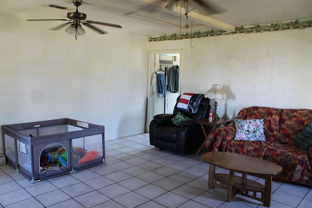 2711 W 83rd St, Odessa, TX 79764 - tiled living room with ceiling fan and a textured ceiling