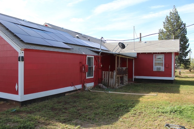 2711 W 83rd St, Odessa, TX 79764 - view of front of home featuring roof mounted solar panels, a front lawn, and a shingled roof