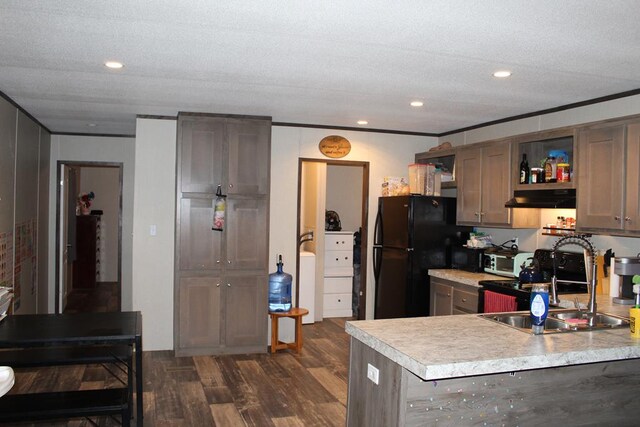 2711 W 83rd St, Odessa, TX 79764 - kitchen with open shelves, light countertops, freestanding refrigerator, under cabinet range hood, and recessed lighting