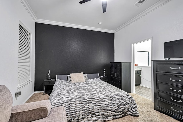 carpeted bedroom with crown molding, connected bathroom, baseboards, and a ceiling fan
