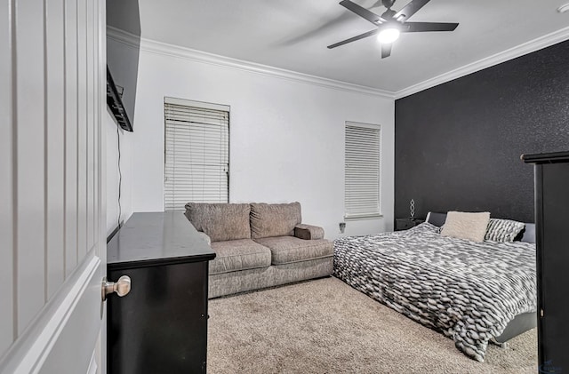 bedroom featuring ornamental molding, carpet floors, and ceiling fan