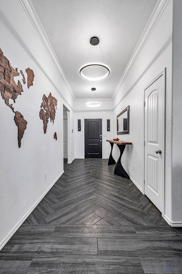 hallway with ornamental molding and baseboards