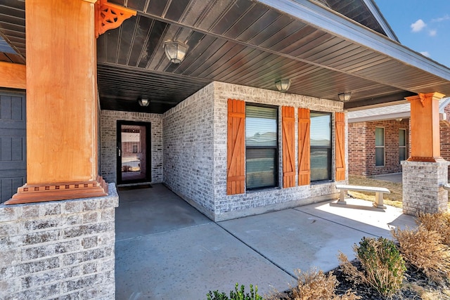 property entrance with brick siding