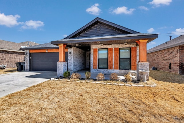 view of front of house featuring a garage, covered porch, concrete driveway, and brick siding