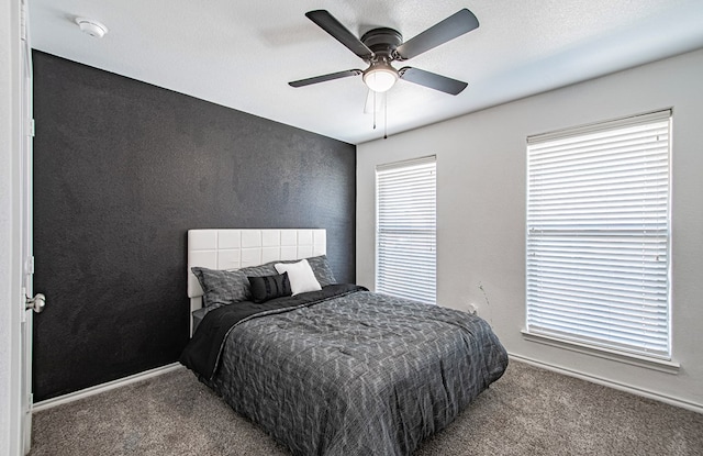 bedroom with carpet, baseboards, and ceiling fan