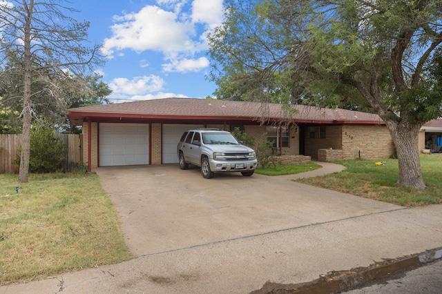 2110 Redbud Ave, Odessa, TX 79761 - ranch-style home with brick siding, a garage, and concrete driveway