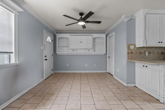 1306 Woodlawn Dr, Odessa, TX 79761 - kitchen featuring a ceiling fan, ornamental molding, open shelves, tasteful backsplash, and light countertops
