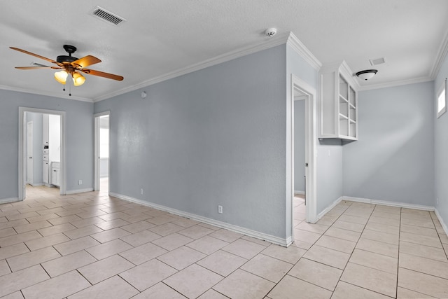 1306 Woodlawn Dr, Odessa, TX 79761 - empty room with ceiling fan, ornamental molding, light tile patterned flooring, and a textured ceiling