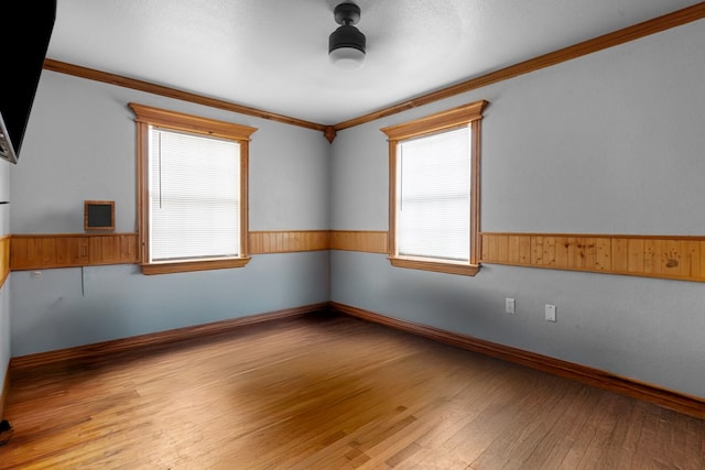 1306 Woodlawn Dr, Odessa, TX 79761 - spare room with crown molding and wood-type flooring