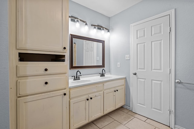 1306 Woodlawn Dr, Odessa, TX 79761 - bathroom featuring tile patterned floors and double vanity