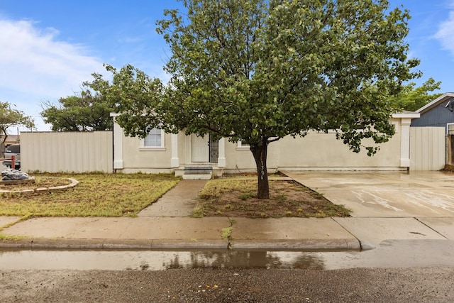 1306 Woodlawn Dr, Odessa, TX 79761 - obstructed view of property featuring concrete driveway
