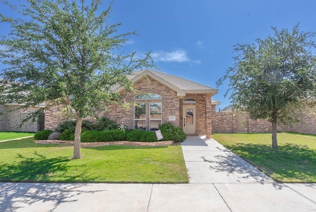 4402 Guadalupe, Midland, TX 79707 - view of front of home featuring brick siding and driveway