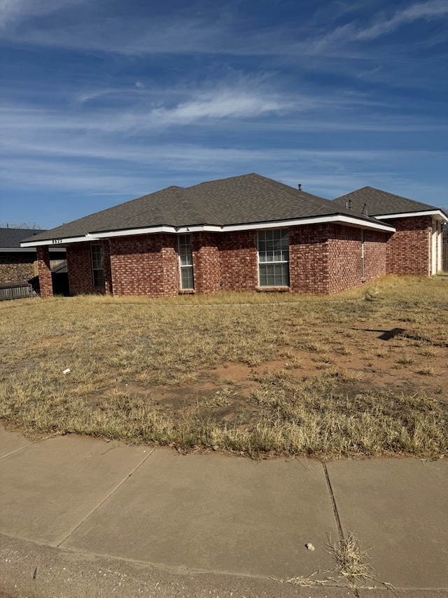 view of property exterior featuring a lawn