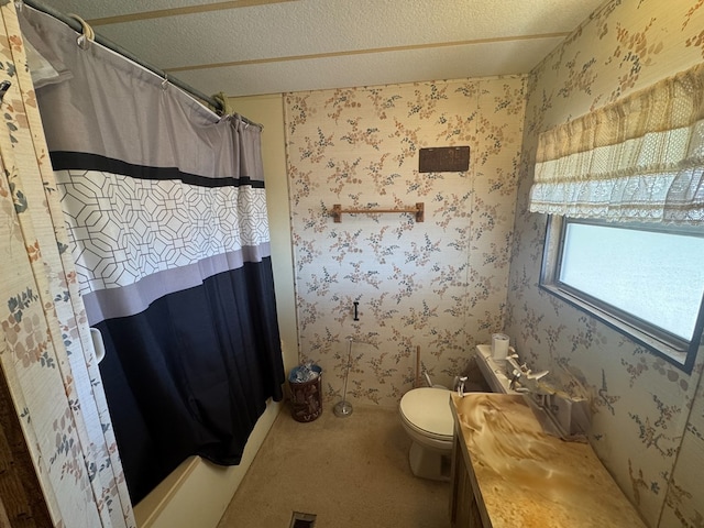 303 Squaw Valley Trl, Fort Davis, TX 79734 - full bath featuring a textured ceiling, a shower with shower curtain, wallpapered walls, and vanity