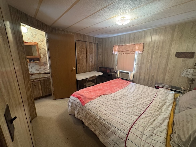303 Squaw Valley Trl, Fort Davis, TX 79734 - bedroom featuring light carpet, wood walls, and wallpapered walls