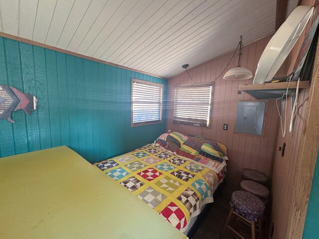303 Squaw Valley Trl, Fort Davis, TX 79734 - bedroom featuring electric panel, vaulted ceiling, wood ceiling, and wooden walls