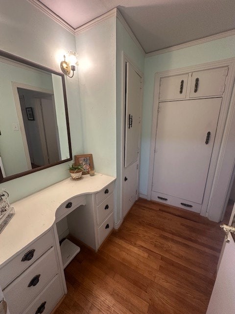 407 N Phelps St, Alpine, TX 79830 - bathroom with wood finished floors, crown molding, and vanity