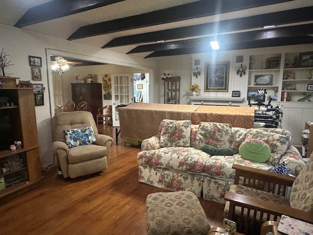407 N Phelps St, Alpine, TX 79830 - living area featuring wood finished floors and beam ceiling