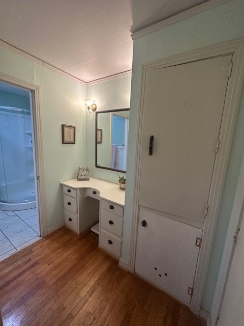 407 N Phelps St, Alpine, TX 79830 - bathroom featuring wood finished floors, vanity, crown molding, and a shower with curtain