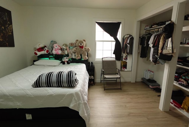 3020 W 15th St, Odessa, TX 79763 - bedroom with wood finished floors and a closet