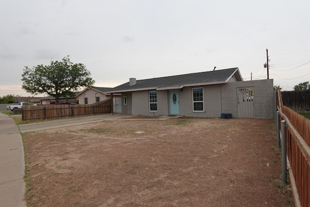 3020 W 15th St, Odessa, TX 79763 - ranch-style home featuring a fenced backyard, brick siding, and driveway